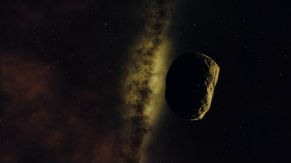 An asteroid, faintly illuminated by a distant galaxy