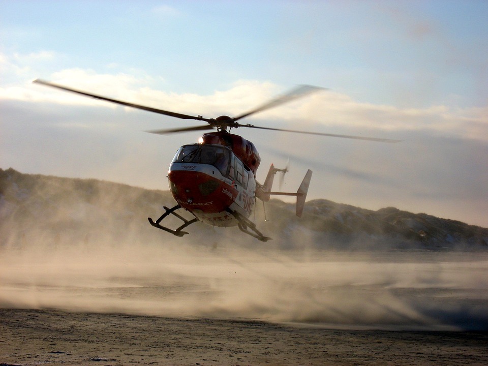 A helicopter landing on a beach