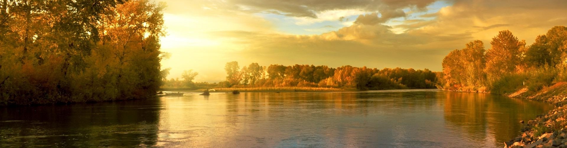 Photo of a river during autumn and sunset
