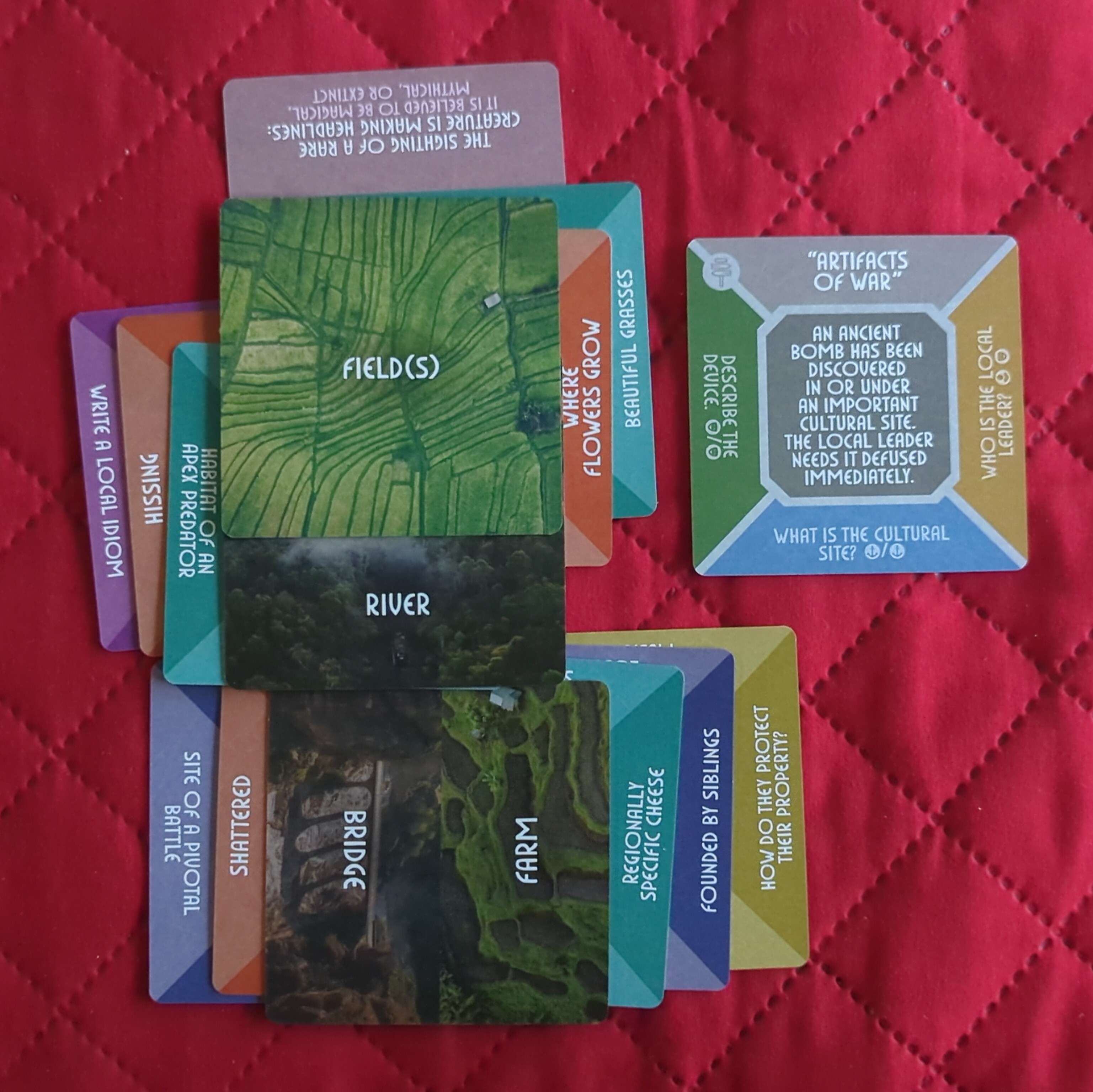 Photo of cards with prompts on them from The Story Engine: Deck of Worlds.