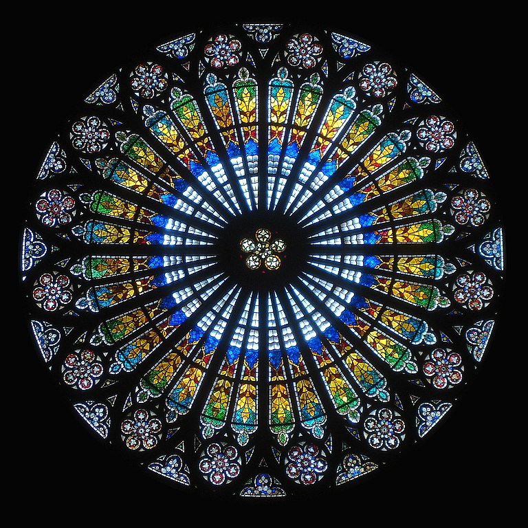 A rose window of abstract designs in stained glass