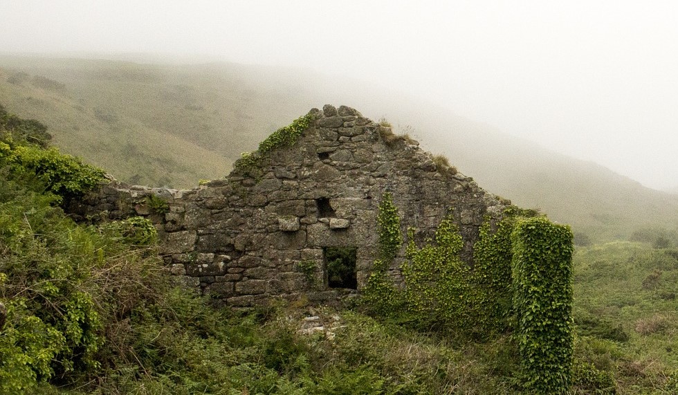 Small ivy-covered stone ruins in the hills