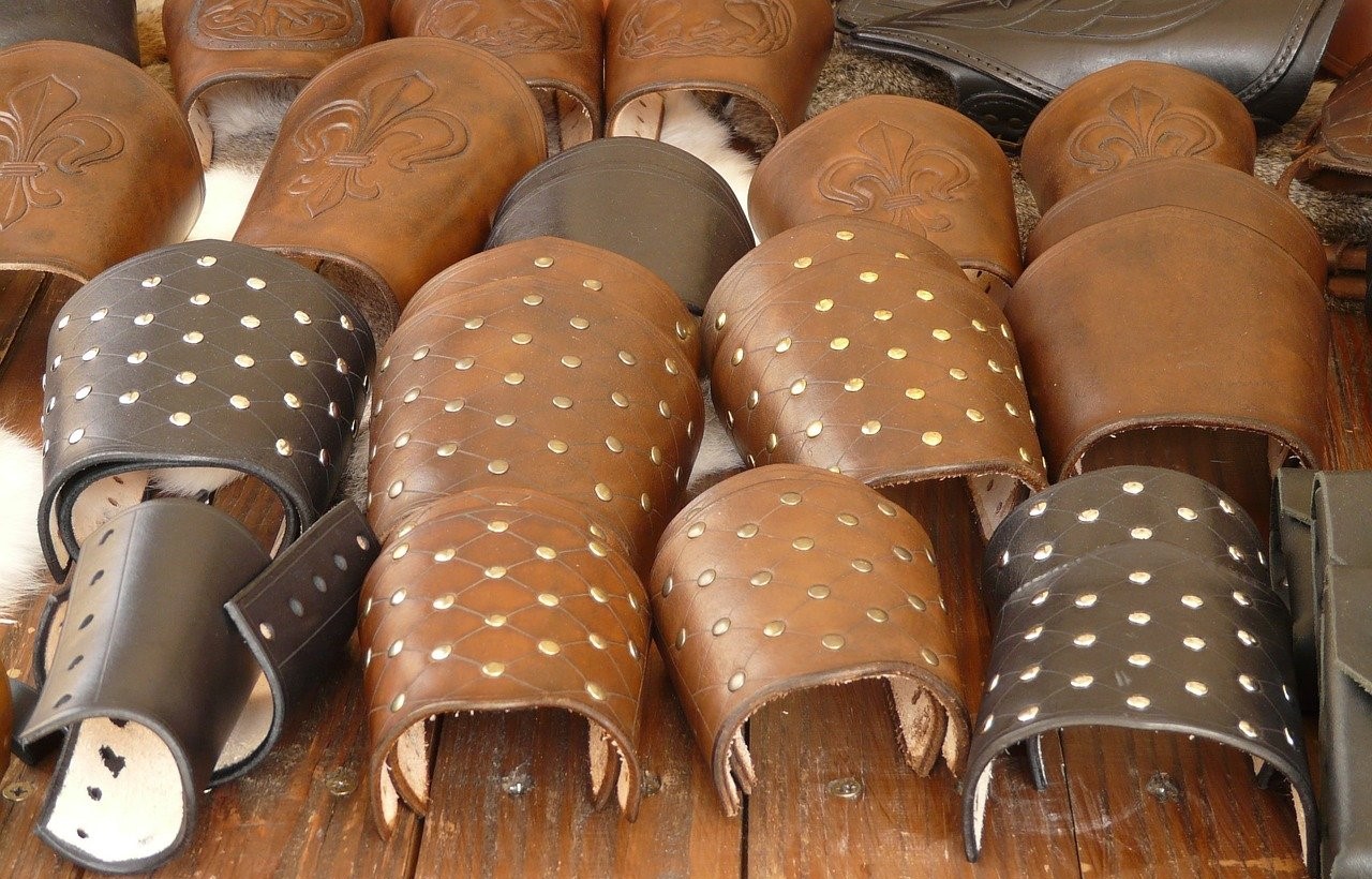 Arm cuffs in shades of brown, some studded, some plain