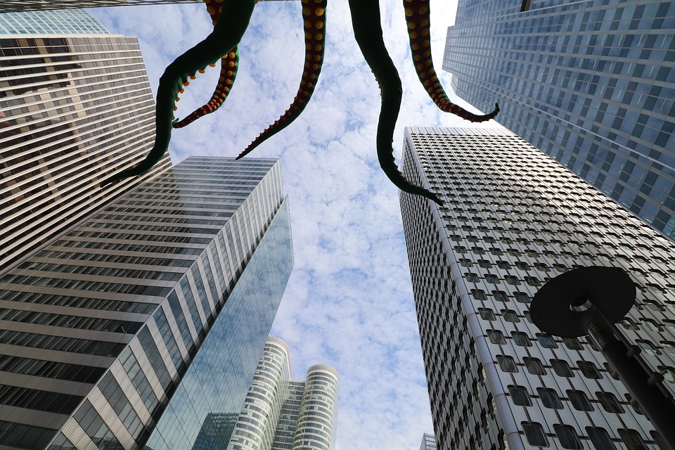 Enormous kraken tentacles viewed from below in a cityscape