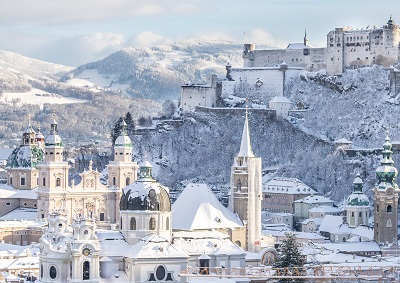 Snowy old city and fortress of Salzburg in winter, sunny day